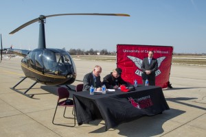 (Courtesy photo) University of Central Missouri President Charles Ambrose, left, and Johnny Rowlands, center,  president of KC Copters, signed a memorandum of understanding that will make the helicopter flight training program available to the public at UCM’s Max B. Swisher Skyhaven Airport.