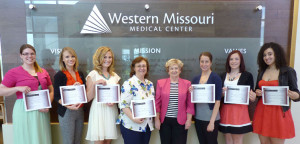 Sharon Franklin, WMMC Auxiliary board president, fifth from left, poses for a photo with the 2013 WMMC Auxiliary Health Care Career $500 Scholarship winners. The students are, from left, Rachel Clancy, of Warrensburg; Callie Hicks, of Whiteman AFB; Storm Simons, of Merriam, Kan.; Renee Kozee, of Holden; Jackie Discher, of Kansas City, Mo.; Gabriella Cavuoti, of Warrensburg; and Jorglynne Shepard, of Lee’s Summit.