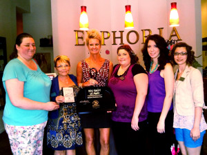 (Courtesy photo) From left, Stephanie Yates, Diane Bradley, Kitty Sandberg (Euphoria Salon & Day Spa owner), Misty Schuster, Hillary Rein and Jennifer Costa pose for a photo after Warrensburg Main Street Inc. presented the spa with the “You Swept us Away” design award Monday. The award is given to business owners who keep the area around its building free of litter, maintain a clean outside appearance through renovation and keep its store windows, and window frames and door frames clean.