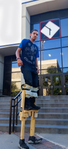 PHOTO BY BRANDON BOWMAN / PHOTO EDITOR Anthony Portis, freshman construction management major, stands tall in his homemade stilts Tuesday in front of the Elliott Student Union.