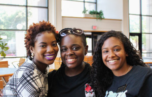 PHOTOS BY BETHANY SHERROW / ASSISTANT NEWS EDITOR From left, Underdogs Vice President Raven Alade, Mentor Keyontae Richardson and President Lauren Newsome share a moment atrium in the Elliott Student Union. 