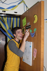 Andrew Canfield showing off his community advisor plaque on his door. He said being a CA is one of the best things he has going for him right now. 