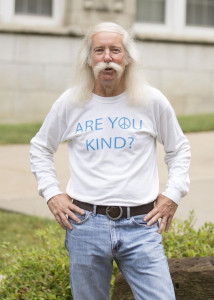 PHOTO FROM UCM'S FACEBOOK PAGE Steve Ciafullo stands on campus wearing his signature 'Are You Kind?" T-shirt, which he often wears to advertise his valuing differences class.