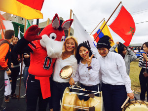 PHOTO BY JIEUN HONG / REPORTER Jieun Hong (second from left) stands with UCM mascot Mule and her Korean friends. From left, Yewon Oh and Eunbi Ko, by the Multipurpose Building before the homecoming parade in 2015. 